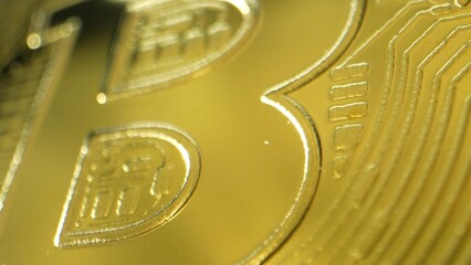 Close-up capture reveals intricate details of a gleaming cryptocurrency coin, symbolizing digital...