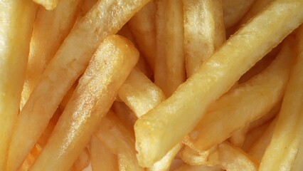 Crispy, golden French fries, a beloved side dish made from sliced potatoes, deep-fried to...