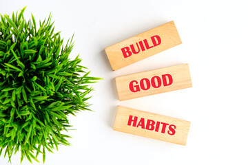 Business, psychological and build good habits concept. Build good habits symbol on wooden blocks on...