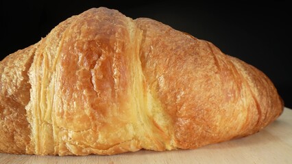 Croissants: High in saturated fats and carbohydrates due to butter and refined flour. Rich, indulgent flavor but calorie-dense and lacking in essential nutrients. Junk food concept. Food background.
