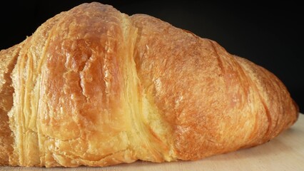 Croissants are cherished for their indulgent taste and luxurious texture, making them a delightful treat enjoyed by people of all ages around the world. Food concept. Fast-food background. 
