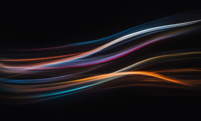 Abstract background. Fantasy. Multi-colored blurry curved lines on a black background.