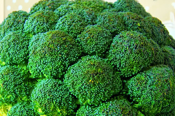 fresh broccoli. large green broccoli lies on a white background, top view closeup vegetable concept