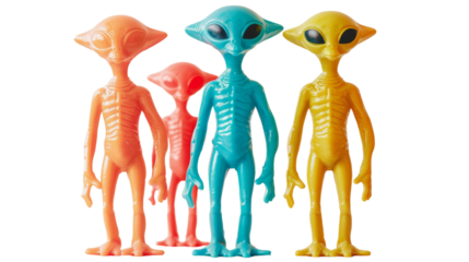 Three colorful alien toys are neatly arranged in a straight line, showcasing their unique designs