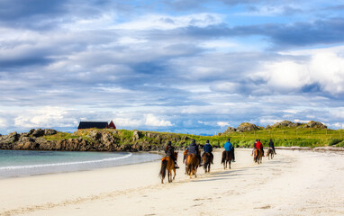 Horse Riding on the Beautiful Beach of Hovsvika on Gimsoya in Lofoten, Norway