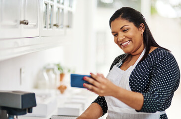 Woman, chef and selfie in kitchen while cooking as influencer live streaming, content creator or recipe. Female person, smartphone and broadcast as baker in home for virtual class, digital or blog