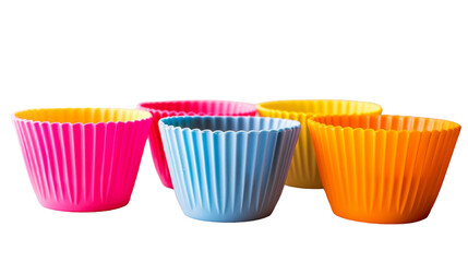 A set of four cupcake cases placed neatly next to each other on a surface