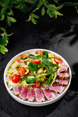 Fresh tuna salad with mixed greens and veggies