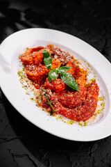 Spicy tomato shrimps on elegant plate