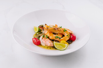 Elegant seafood pasta dish with lime garnish
