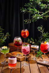 Assortment of colorful cocktails on rustic wooden surface