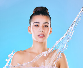 Water, splash and portrait of woman in studio for natural hydration, cosmetics and skincare. Aqua,...