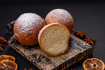 Round homemade cheese donuts glazed with citrus flavor