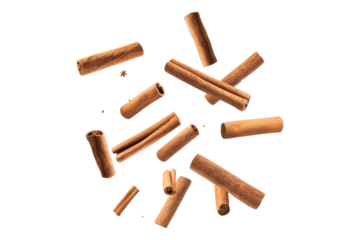 Falling cinnamon stick isolated on white background