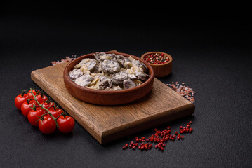 Boiled chicken hearts cut into slices with onions and cream sauce