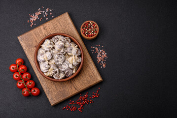 Boiled chicken hearts cut into slices with onions and cream sauce