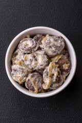 Boiled chicken hearts cut into slices with onions and cream sauce