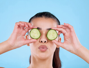 Girl, face and beauty in studio with cucumber for healthy diet, skincare and hydration for glowing...