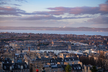 Edinburgh Scotland: 13th Feb 2024: Edinburgh city skyline and  Firth of Forth view from Carlton Hill lookout point at dusk