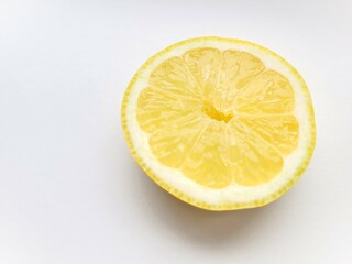 Juicy, sliced lemon on a bright background.