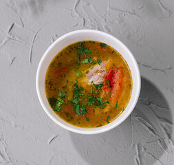 Hearty homemade soup in white bowl