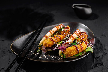 tempura sushi in Bao sandwich on elegant plate