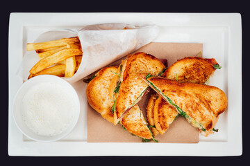 Classic club sandwich and fries with dip