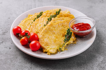 Cheesy omelette or chicken steak with cherry tomatoes and sauce