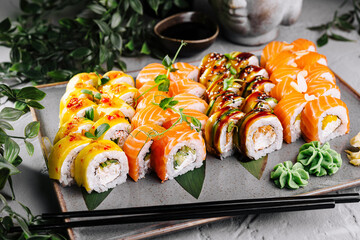 Assorted sushi rolls platter on elegant table setting