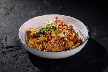 Exotic asian stir-fry dish with sesame seeds