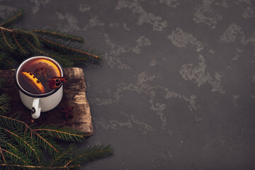 Mulled wine in white rustic mugs with spices and citrus fruits.top view