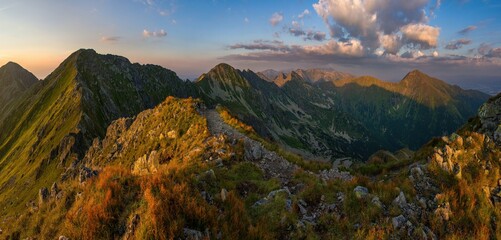 Beautiful summer mountain wide panorama from West Tatras during a beautiful sunset. A wonderful tourist experience.