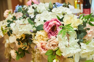 Decor for a wedding or engagement party. Close-up of floristry, flowers and decorative elements.