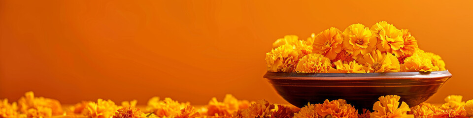 A bowl of yellow flowers sits on a table