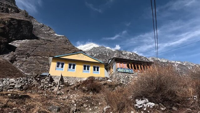 Yellow holte of langtang village under towering summits . Langtang valley Trek of Nepal, Himalayas.