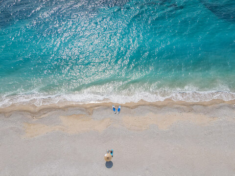 Aerial view of a sandy beach with turquoise water