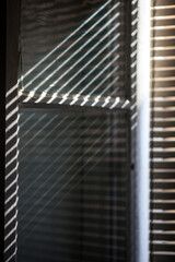 Obraz premium Sunlight through blinds on a hot Seville day