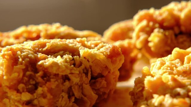 chicken fried wings and drumsticks on white plate in close-up