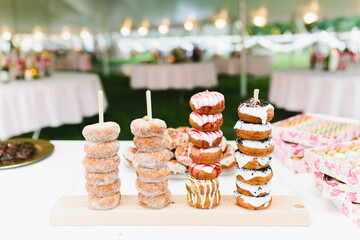 Sugar and glaze donut display at dessert table