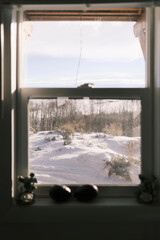 Serene winter landscape view from a cozy cabin window