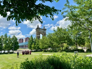 Graduates posing in park near Roebling Bridge, Cincinnati, OH