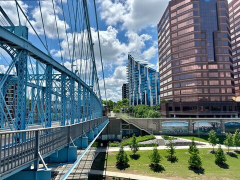 Roebling Bridge leading to modern buildings in Newport, KY