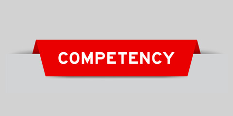 Red color inserted label with word competency on gray background