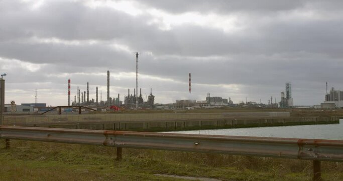 Dunkirk, France - A View of the Industrial Port on a Cloudy Afternoon - Wide Shot