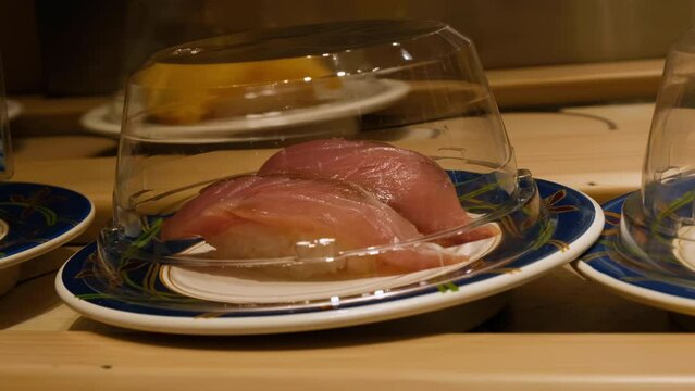 Conveyor belt sushi in Japanese restaurant