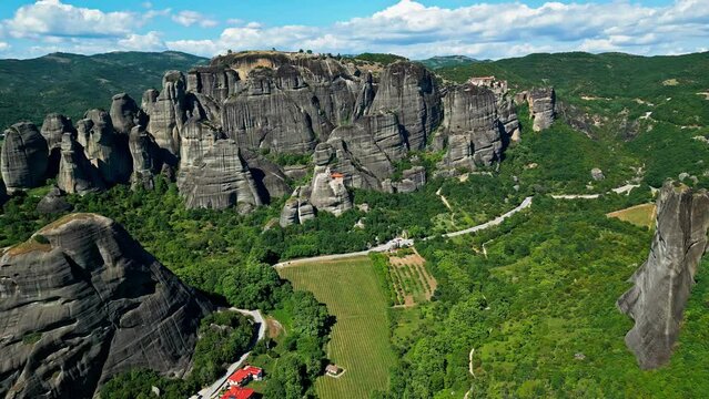 Aerial view overlooking mountains and cloisters in Meteora, sunny day in Greece