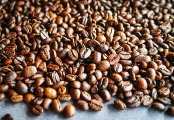 Close up of backdrop dark brown coffee beans and Textured background of freshly roasted coffee beans
