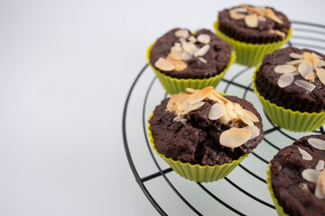 Closeup shot of homemade chocolate muffins on a cooking rack