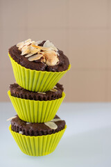 Closeup shot of homemade chocolate muffins stacked on top of each other