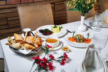 White Table With Platters of Food